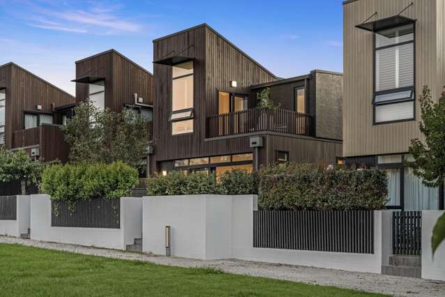 Willis Bond living, framed by greenery