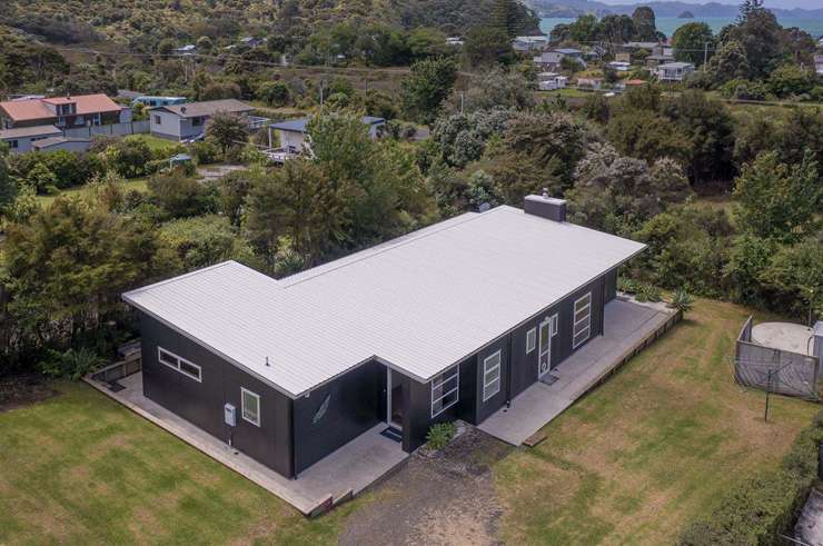 An absolute beachfront home at 22 McCall Avenue, in Pauanui, is one of dozens of Coromandel homes to hit the market recently. Photo / Supplied