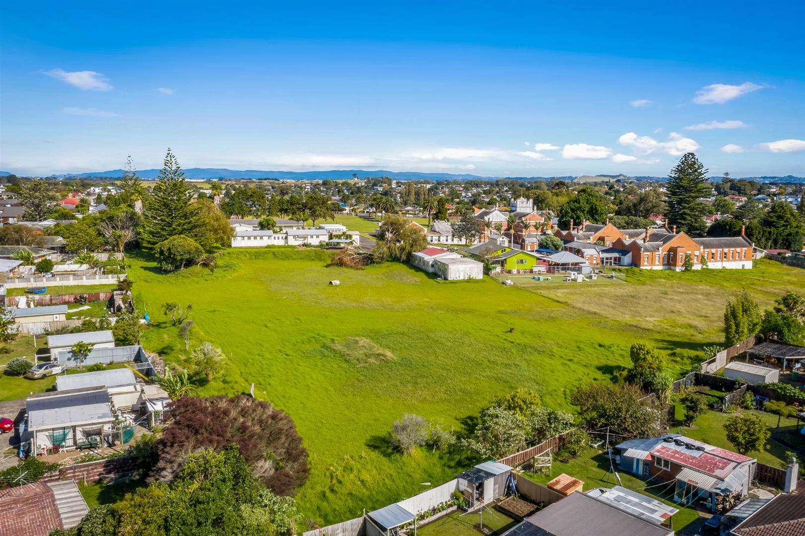 aerial view of suburban street with architect plan superimposed  50 Mountain View Road Morningside Auckland