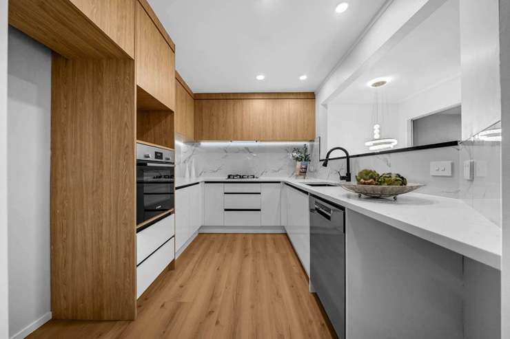 A four-bedroom townhouse on Raleigh Road, in Auckland’s Northcote, is back on the market after the vendor bought it at a court-ordered auction earlier this year. Photo / Supplied
