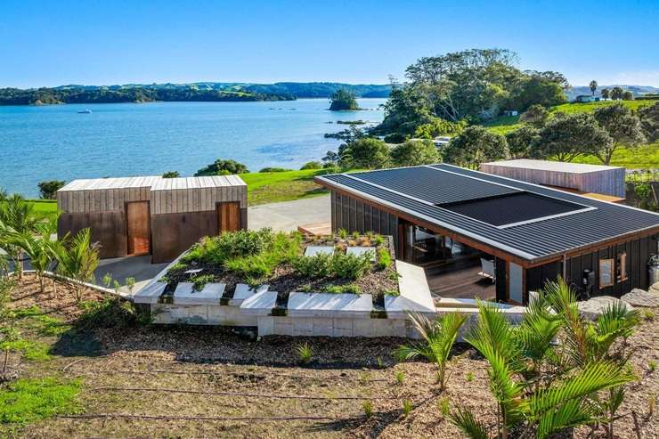 The four-bedroom waterfront home on Young Street, in Mahurangi East, attracted a lot of interest from Auckland buyers. Photo / Supplied