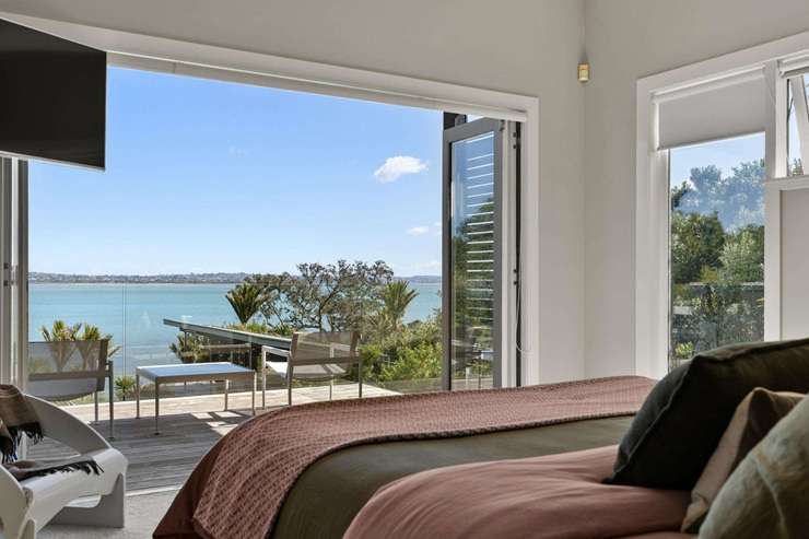 A waterfront property at 34 Harbour View Road, in Auckland's Point Chevalier, is expecting to sell for well above its $6.7m RV. Photo / Supplied