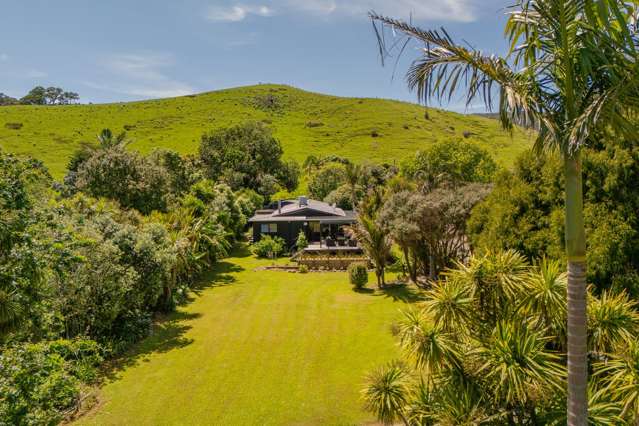 Lush Coastal Oasis with Dual Living on One Acre