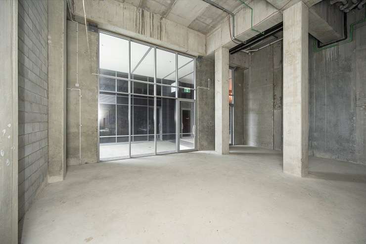 grey shops with apartments above and courtyard  units 2 and 4, 27 SugarTree apartments, 27 Union Street, Auckland City