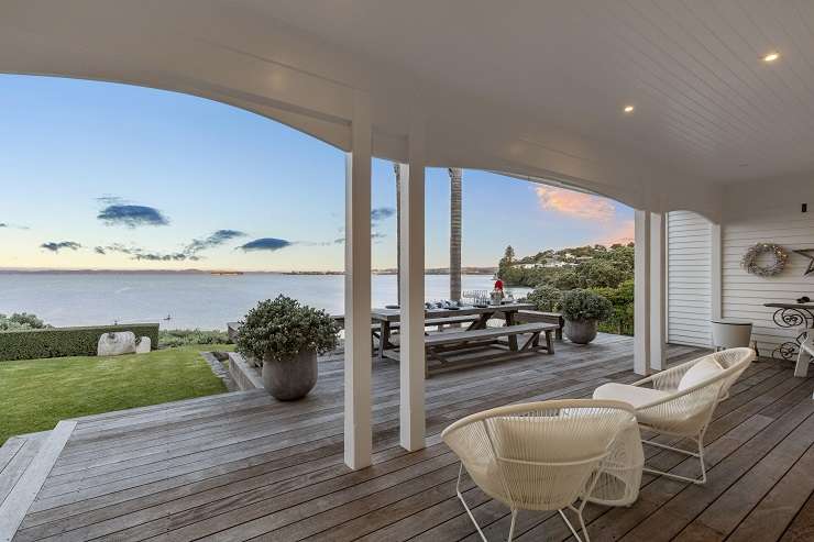 1 Marine Parade Mellons Bay east Auckland   White mansion on lawns above tree-covered cliffs and sea