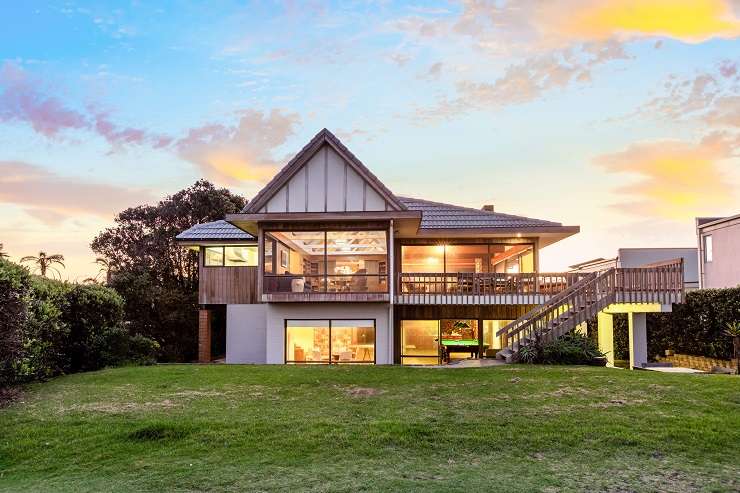 The waterfront five-bedroom house on the Hibiscus Coast Highway, in Orewa, Auckland, was snapped up by a local family. Photo / Supplied