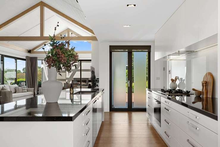 The four-bedroom home at 23 East Stream Lane, in Clearwater, Christchurch, has an RV of $2.7m and a declared auction reserve of $2.3m. Photo / Supplied