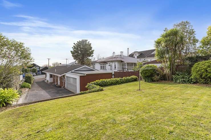 blue swimming pool in front of 1970s brick house 116 St Andrews Road,Epsom, AUckland