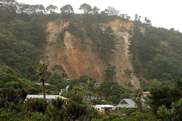 The effects of flooding and land slips on properties lining Auckland's Shore Road, in Remuera, and above it, on Arney Road. Photo / Hayden Woodward