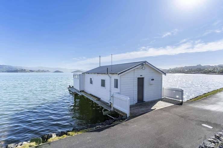 The brightly painted boatshed at 6083 Portobello Road, in Broad Bay, Dunedin, is one of the harbour's most photogenic. Photo / Supplied