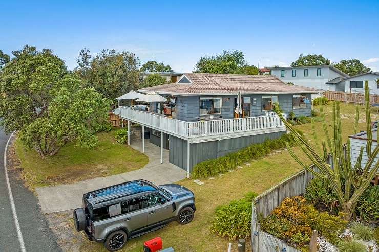 Two families joined together to buy a three-bedroom home on Meiklejohn Way, in Omaha, with the sale price well above the property's <img.25m CV. Photo / Supplied