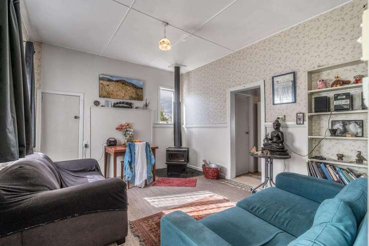 A two-bedroom home for sale at 11 High Street East, in Nightcaps, Southland, is seeking offers over <img59,000. Photo / Supplied