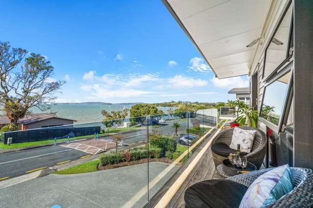 Ocean Views • Two Level Living • Walk to Beach