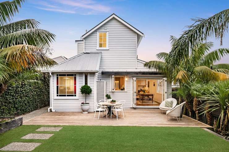 A family toughed it out over 220 bids to buy a plaster-clad home in Auckland's double grammar zone, on Brookland Place, in Remuera. Photo / Supplied