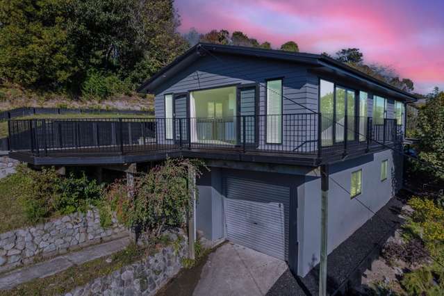 Must see - elevated and modern home with views!