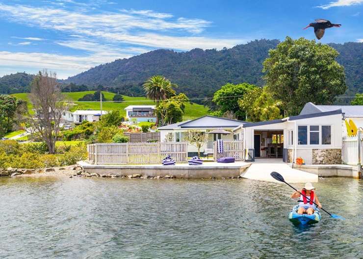 A classic beachfront bach at 1 Campbell Road, in Campbells Beach, on the Tawharanui Peninsula has only changed hands twice in 60 years. Photo / Supplied