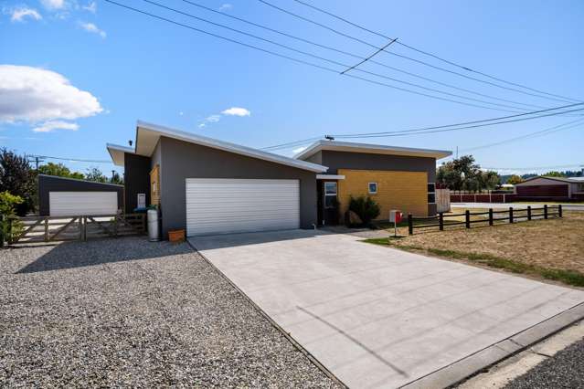 A Modern Delight with 4 car garaging!