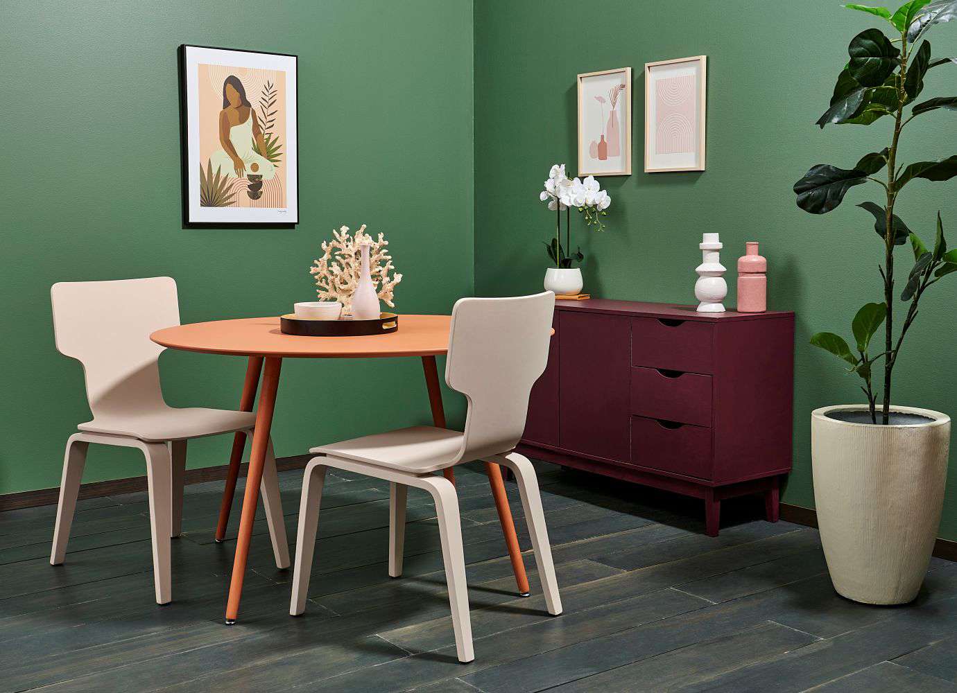 Rustic reds and charcoal floorboards bring earthy variety and texture to a nature-inspired dining room. Floor stain colour washed in Resene Colorwood Shade, walls painted in Resene Rivergum, with skirting in Resene Colorwood Charred Black. Project by Anni